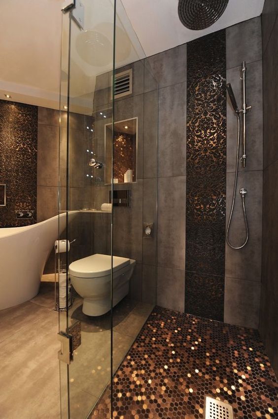 stunning shower with pennu floor tiles and dark lace tile runner