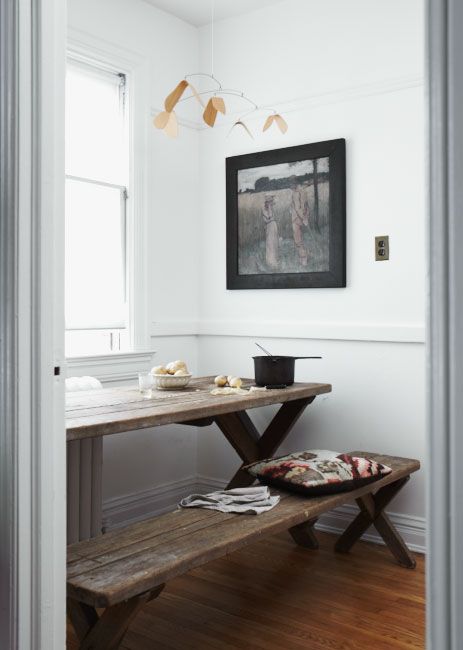 small dining area with a stained wooden table and benches