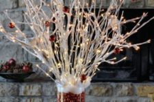 19 whitewahsed branches with red ornaments and lights