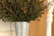 20 galvanized bucket with evergreen and light branches