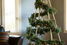 22 modern take on a traditional Christmas tree made of a frame and a fir garland over it