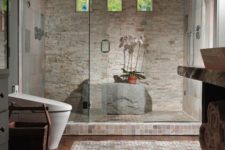 22 stone-clad steam room with a shower and a large stone instead of a bench