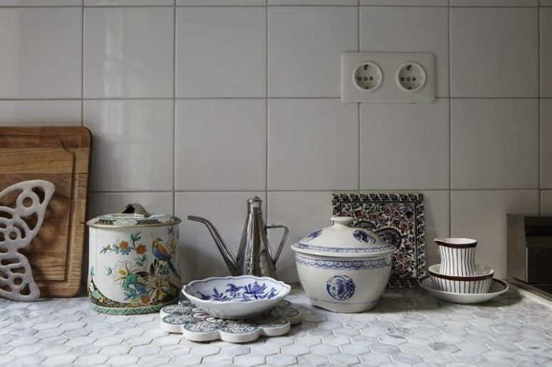 usual white tiles on the backsplash and hexagon penny tiles on the countertop