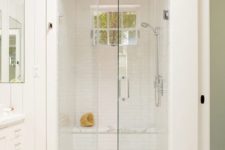 24 all-white bathroom and steam room with a shower