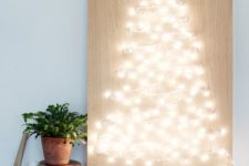27 string light Christmas tree artwork is such a cool and easy idea