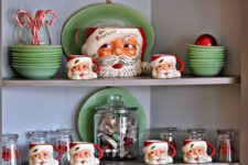 28 green dishes and Santa mugs for a retro kitchen display