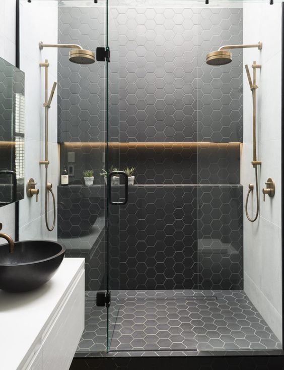 black honeycomb tiles in the shower to highlight the zone