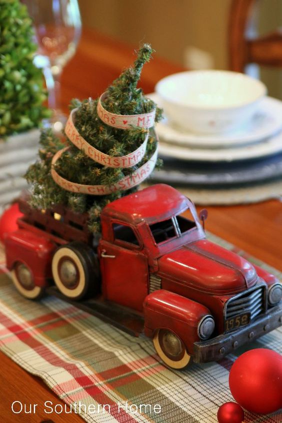 old car with a small Christmas tree for decor