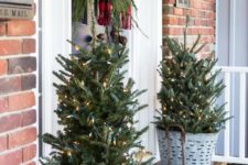 29 trees with lights in old buckets for rustic front porch decor
