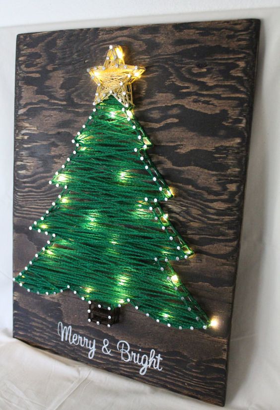 yarn Christmas tree artwork with string light incorporated