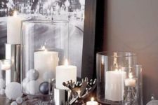 32 metallic and white mantel decor with large candles