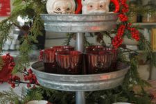 35 vintage Santa mugs on a galvanized cupcake stand