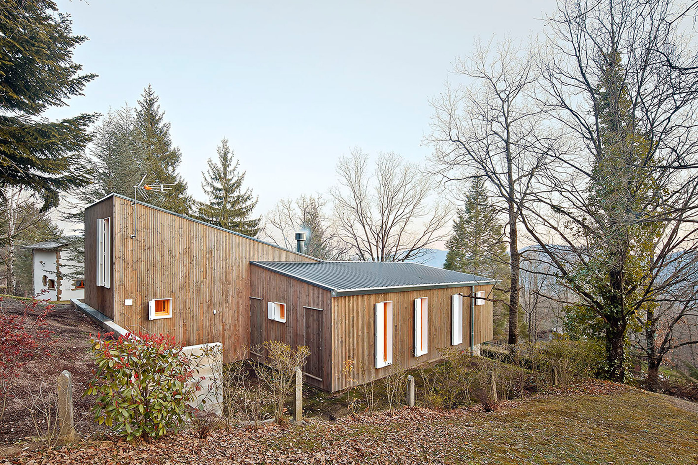 Pine clad was widely used outside and inside the cottage to highlight that it's a forest home