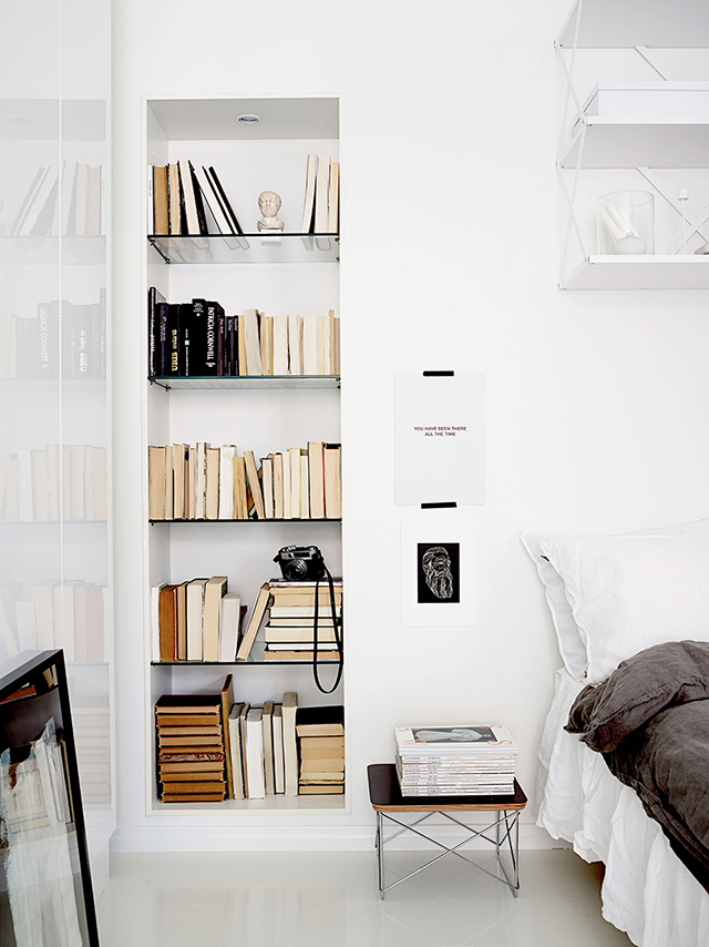 in wall storage solution The decor is flawless and timeless due to the use of paper-white color and adding greys and black to it. In-wall storage also adds an interesting-looking and practical touch to the interior.