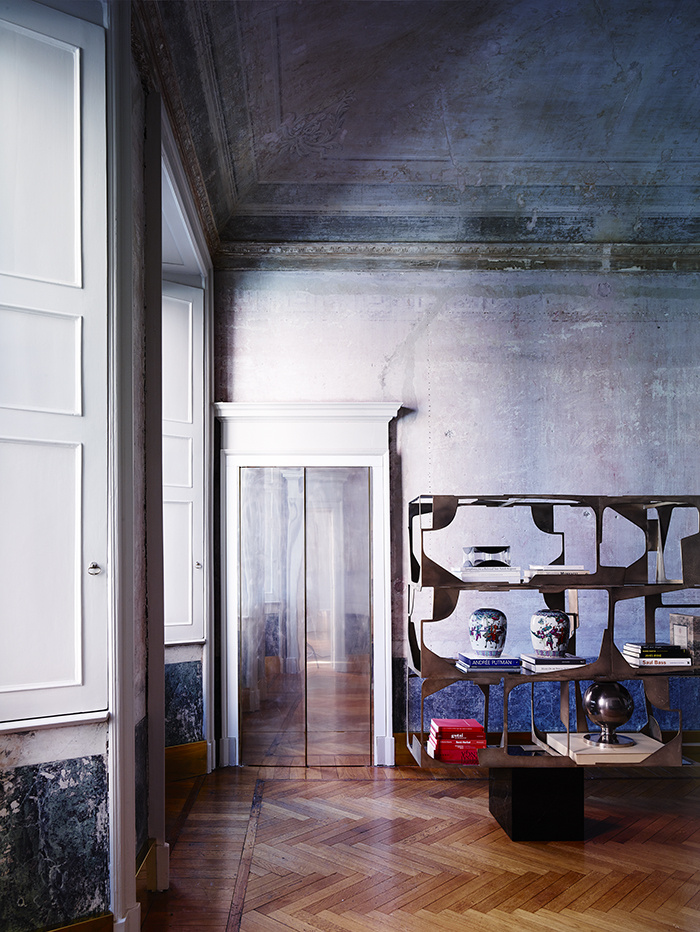 The owner found and restored the original frescoes and molding to make the sapce more refined