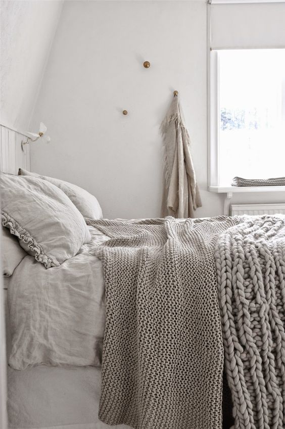 taupe textiles, especially knit ones, make this bedroom very inviting and peaceful
