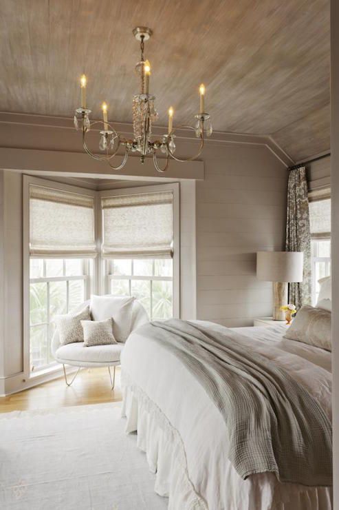 rustic taupe bedroom with planked walls and ceiling, taupe textiles