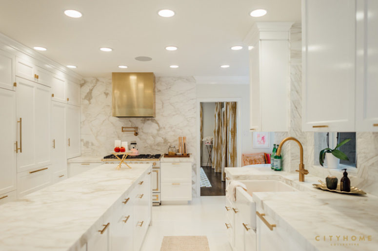 luxorious marble kitchen The kitchen is totally clad with marble and spruced up with shiny brass touches and lots of lights