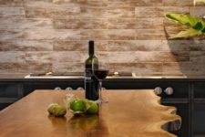 04 a beautiful raw wood edge kitchen island in an industrial kitchen makes a statement