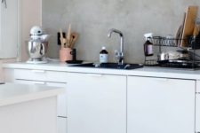 04 concrete walls and backsplashes in the kitchen is a practical solution