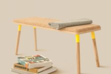 05 a cork seat and wooden legs with a neon yellow accent