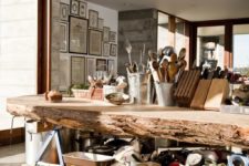 05 open kitchen layout with a large rough wood edge island that accomodates everything