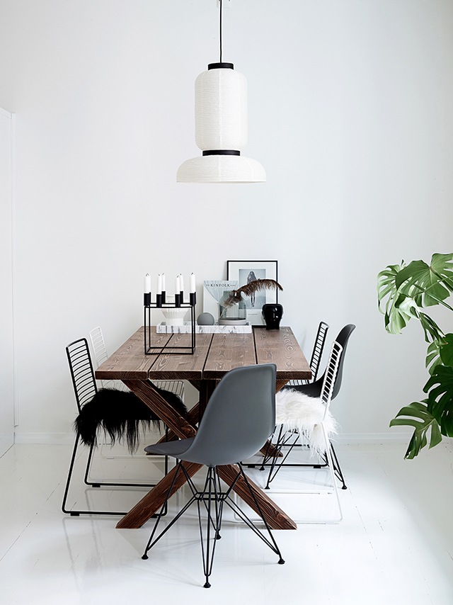 The dining area has a rustic-style wooden dining table and various chairs