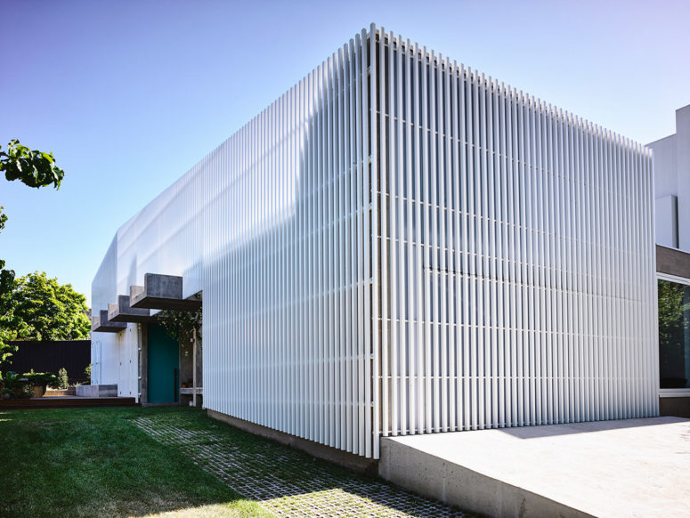The white slats offer structural clarity and reference the architecture of the neighbourhood for visual cohesion