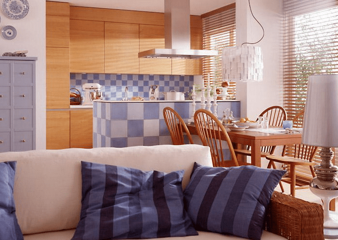 a dining table defines the dining space and the sofa separates its sitting zone