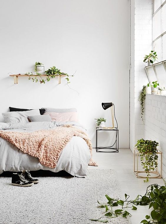simple Nordic bedroom is refreshed with small greenery pieces