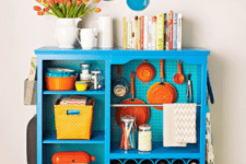 08 a kitchen island with a pegboard inside for storing various stuff