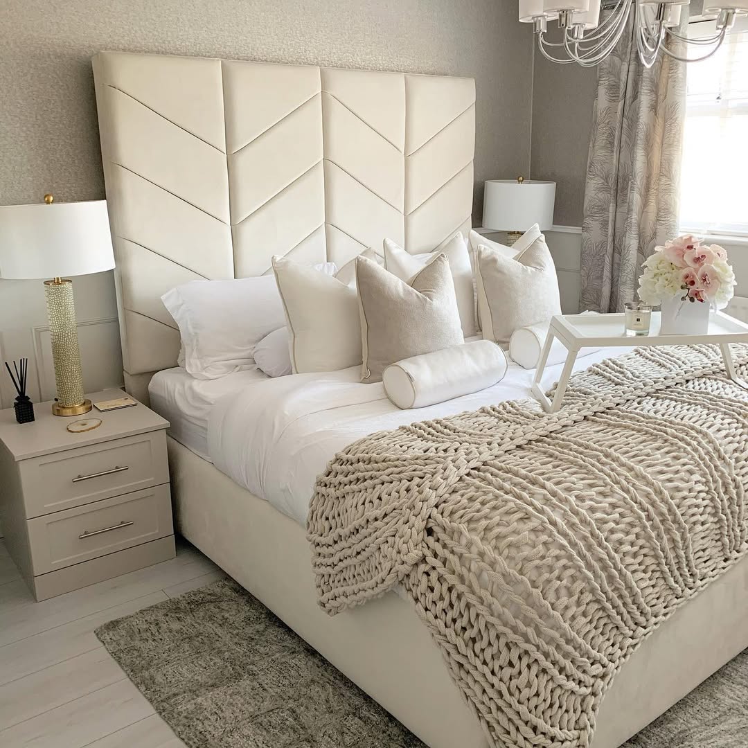 darker taupe shade on the upholstered oversized headboard and curtains for a refined look
