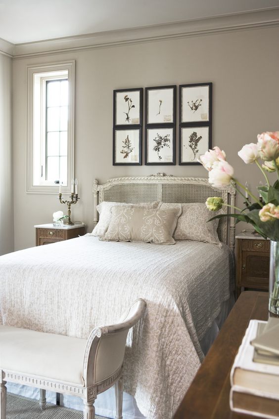 French country style bedroom with light taupe walls and a bed