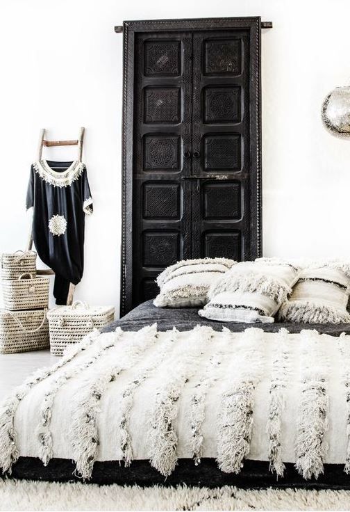 Moroccan wedding blanket + handira pillows create an ambience here