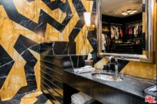 09 This futuristic bathroom is great with its yellow and black design and a marble tabletop