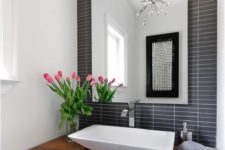 09 black and white graphic bathroom with a raw wood edge floating vanity