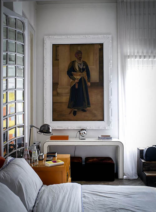 Modern glam furniture and antique artworks look amazing together creating an unusual space with its character
