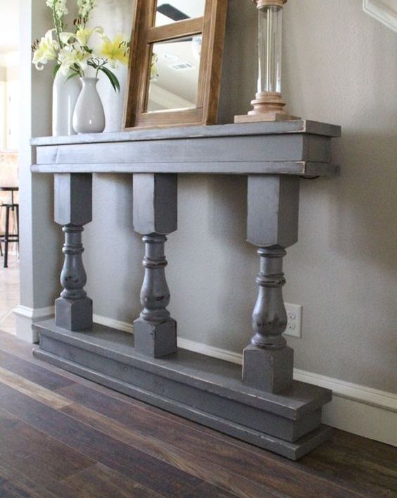 narrow entryway table with pillars in blue