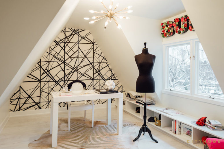 The owner's home office is decorated with a lot of feminine touches