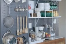 12 dark grey wall storage with utensils and cooking stuff