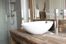 13  a modern bathroom with a countertop and mirror frame from recycled materials