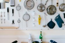 14 kitchen pegboard wall storage over the dining area