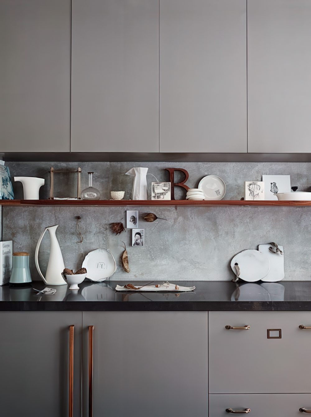 minimalist kitchen cabinets with marble and a black workspace