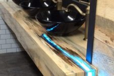 16 a reclaimed wood countertop with a resin insert