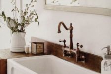 17 a recyled wood countertop is a must for a farmhouse bathroom