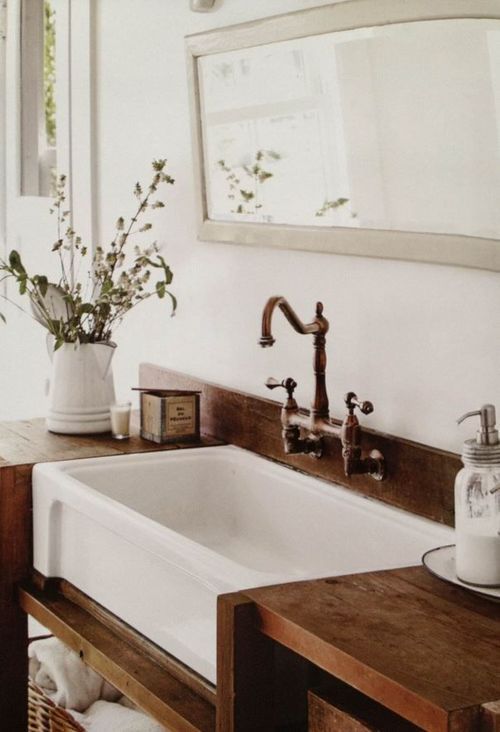 a recyled wood countertop is a must for a farmhouse bathroom