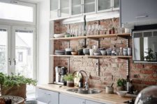 18 industrial-styled kitchen with reclaimed wood countertops of a coordinating color