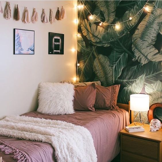 leaf-print statement wall, tassels, lights and faux fur
