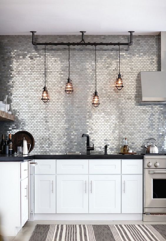 silver tiles and pipe lamp holder are to add a pretty textural touch here