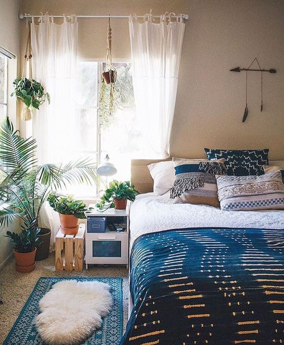 rustic and boho bedroom with an indigo bedspread
